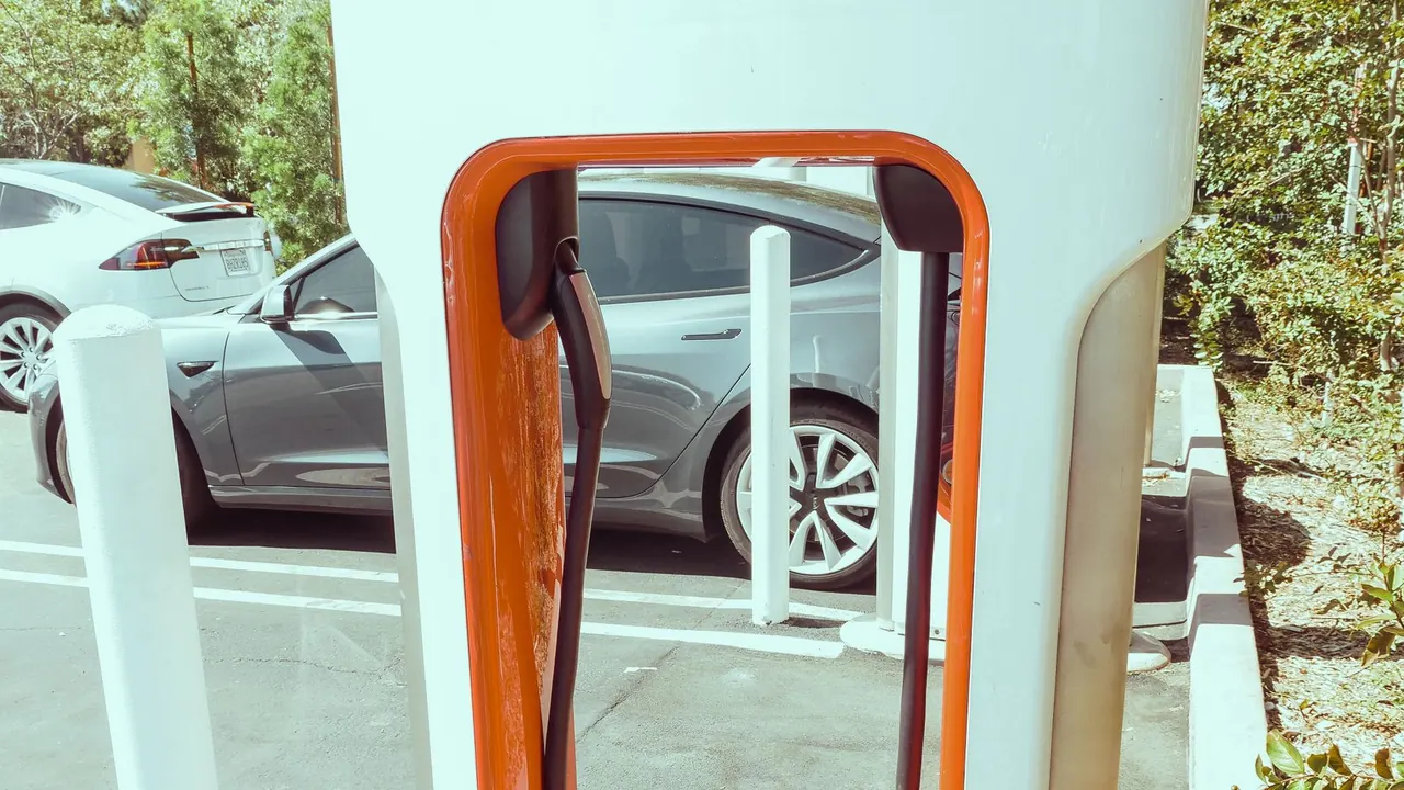Modern public electric vehicle charging station in a parking area